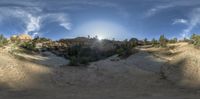 a very big nice looking looking panorama of the sky above the mountain range and some trees