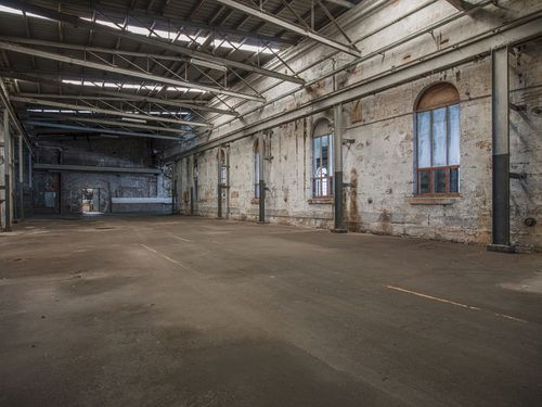 Large Industrial Building With Windows And Open Space In Urban City 