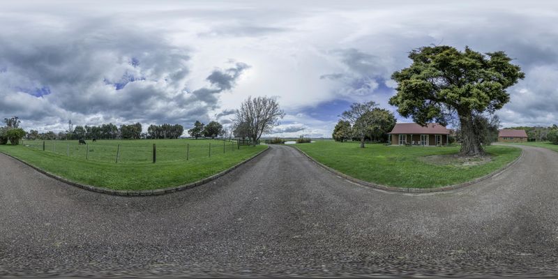 Scenic View of a Rural Landscape with a Gravel Road and Lush Vegetation ...