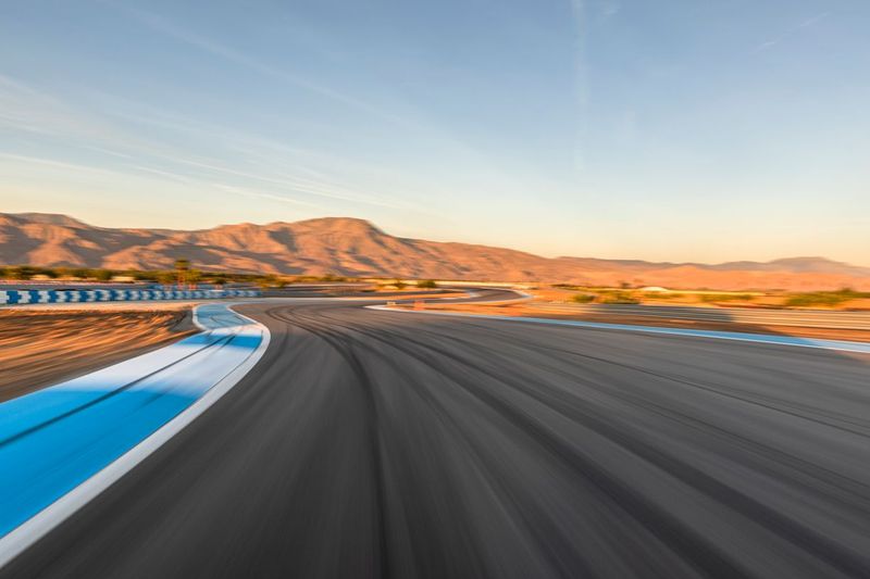An Asphalt Curve at Dawn with Clouds in the USA HDRi Maps and Backplates