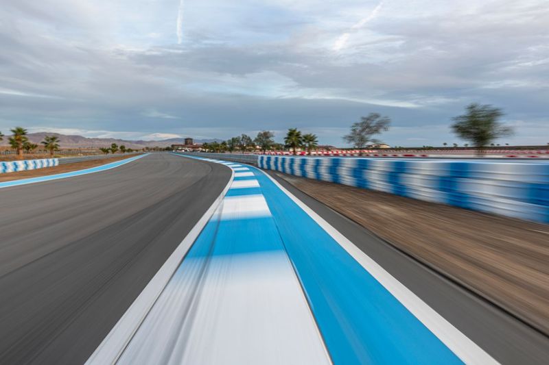 Asphalt Curve on a Race Track with Clouds HDRi Maps and Backplates