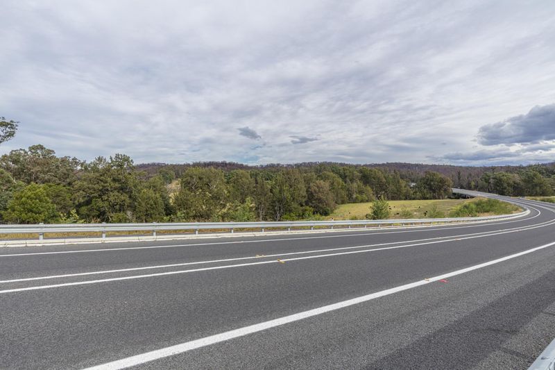Scenic Road Through Lush Green Fields - HDRi Maps and Backplates