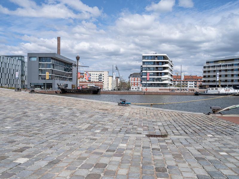 Cityscape of Bremen, Germany with Gray Cobbled Road Next to Buildings ...