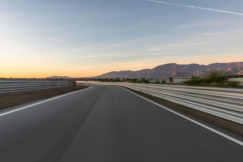 Curve on Race Track with Clouds at Break of Day HDRi Maps and Backplates