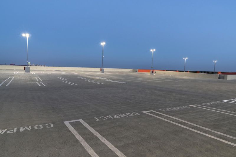 Empty Parking Lot in a Lit Cityscape at Night HDRi Maps and Backplates
