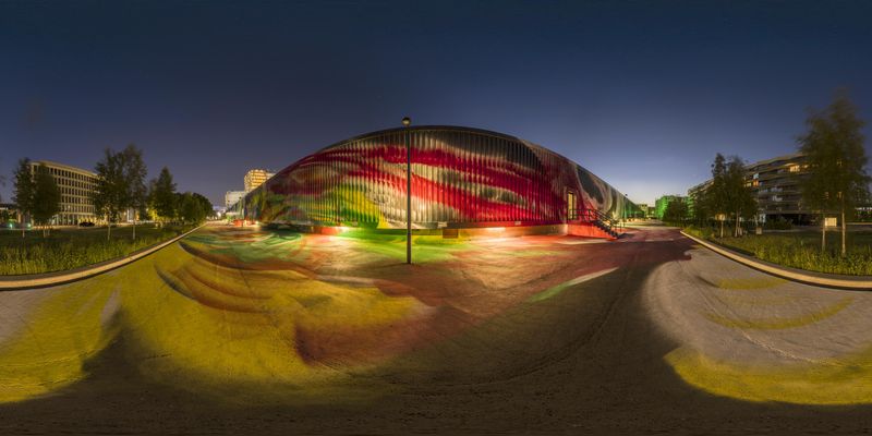 Skateboarder on a Colorful Paint-Covered Ramp in the Night-Time Park ...