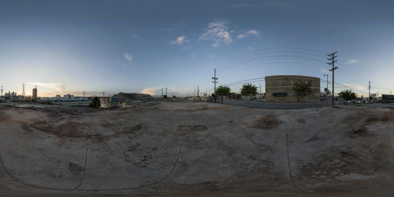 Skateboarder on a Ramp with Cityscape at Dawn HDRi Maps and Backplates
