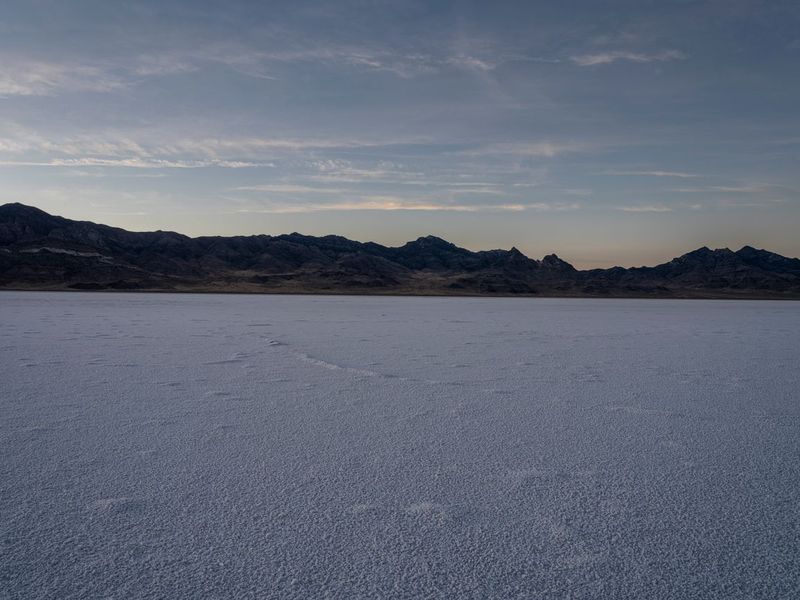 Snow Covered Ground with Mountains and Cloudy Sky HDRi Maps and Backplates