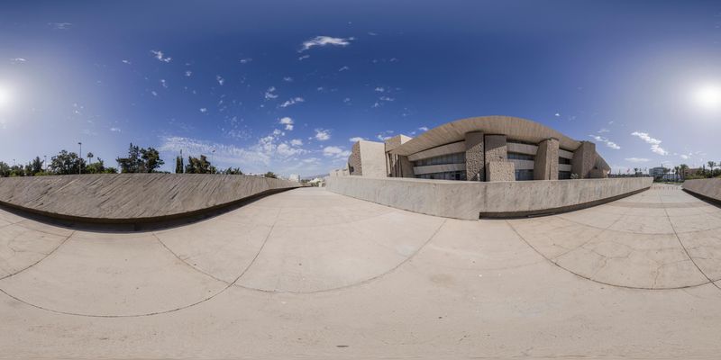 Spain's Modern Skateboard Ramp: Reflection of Sky and Sun